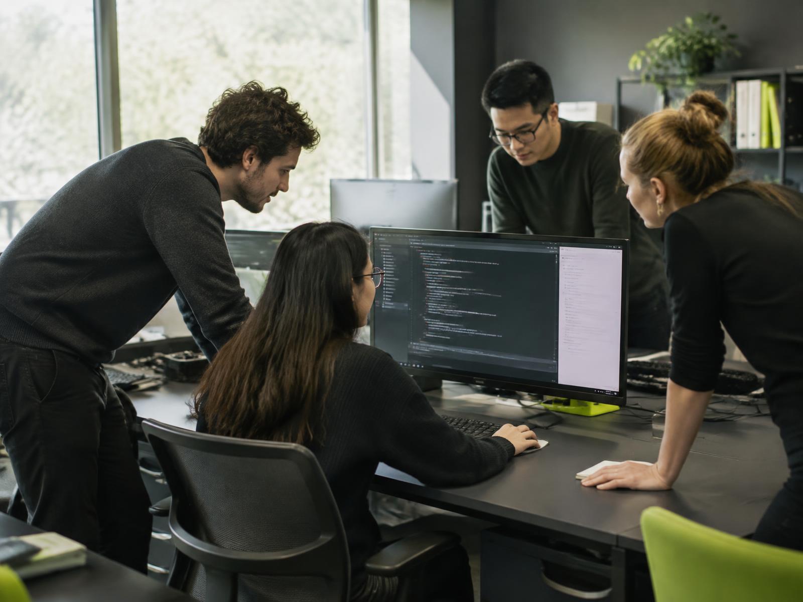 Software engineering team reviewing an application together